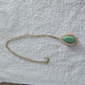 Gold Tear drop necklace with jade color stone.